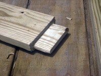 Detail of the tenon used to connect the two-by-sixes forming the frame on the inside of the door.